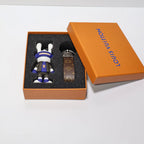Rabbit boxer keychain arranged beside its strap and box lid