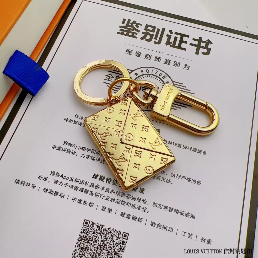 Gold-tone envelope keychain with engraved monogram and swivel clasp