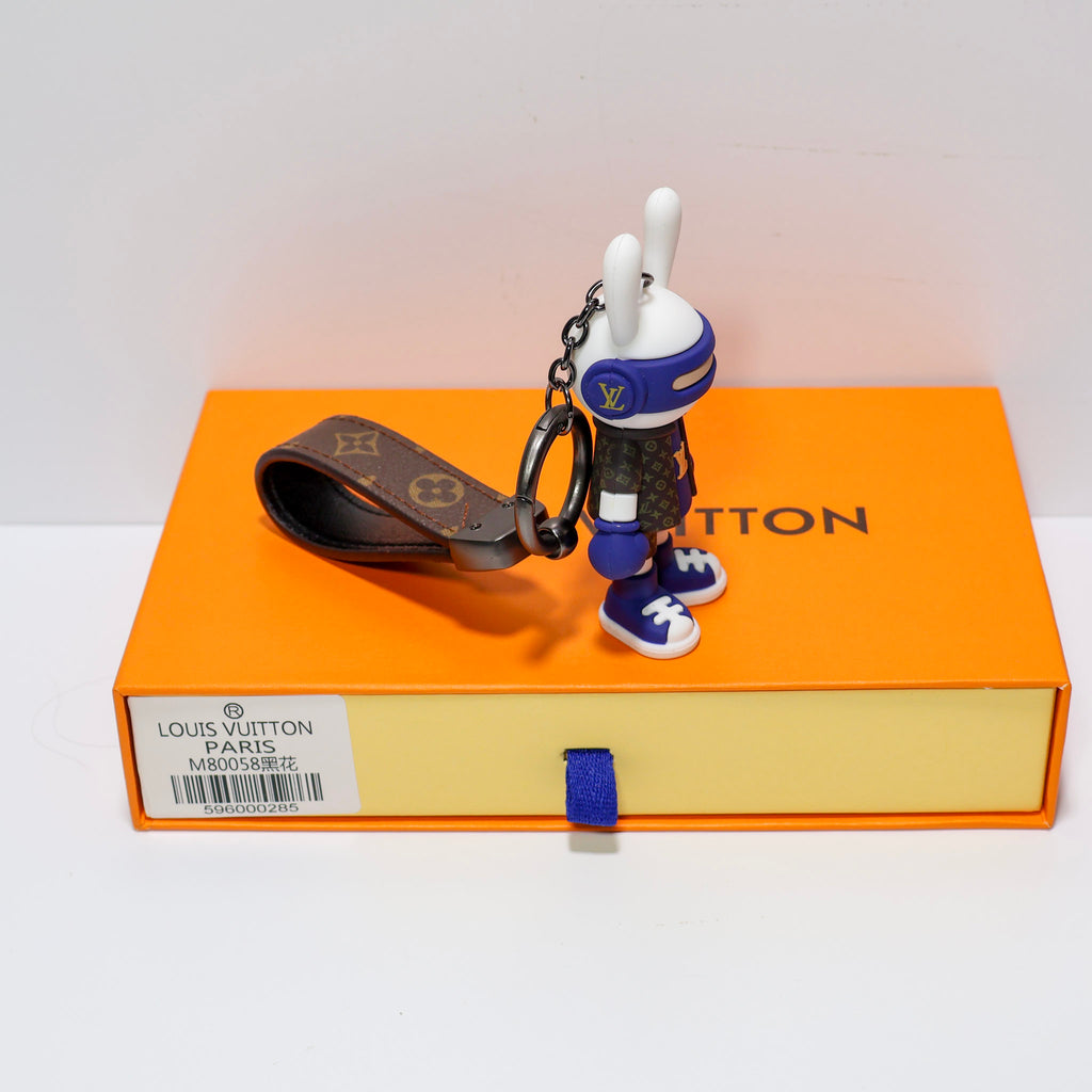 Side view of blue rabbit keychain and connecting chain