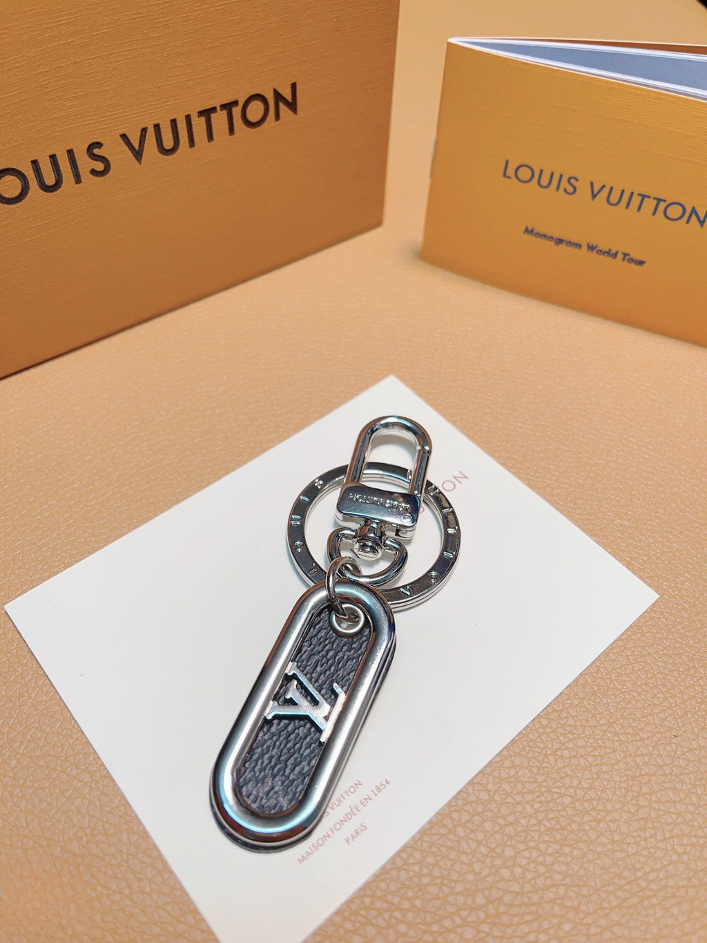 Dark textured loop keychain with silver-tone LV detail
