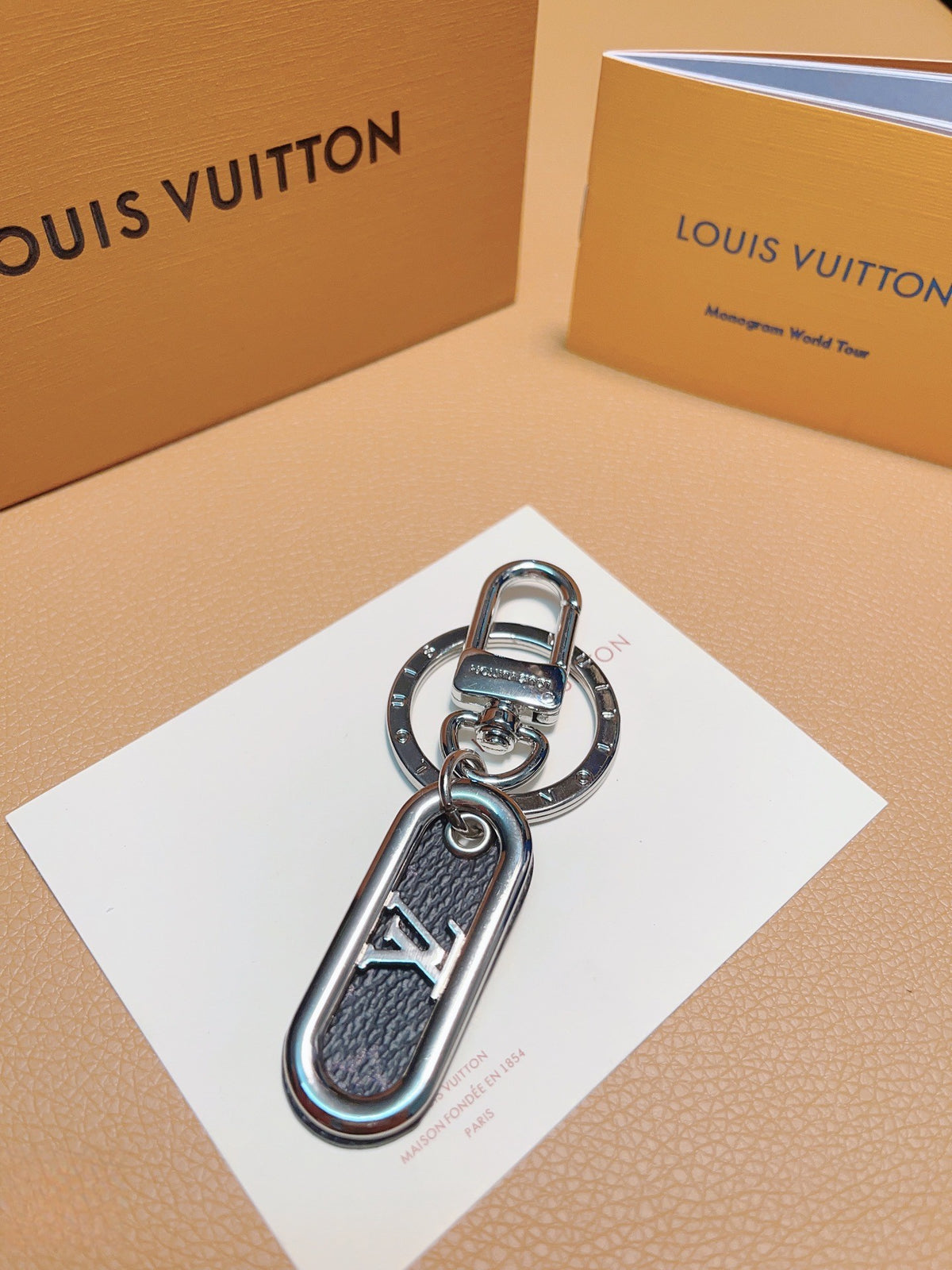 Dark textured loop keychain with silver-tone LV detail
