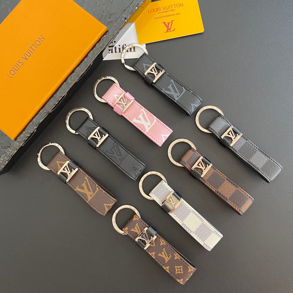 Monogram and checkered key holders arranged in assorted colors