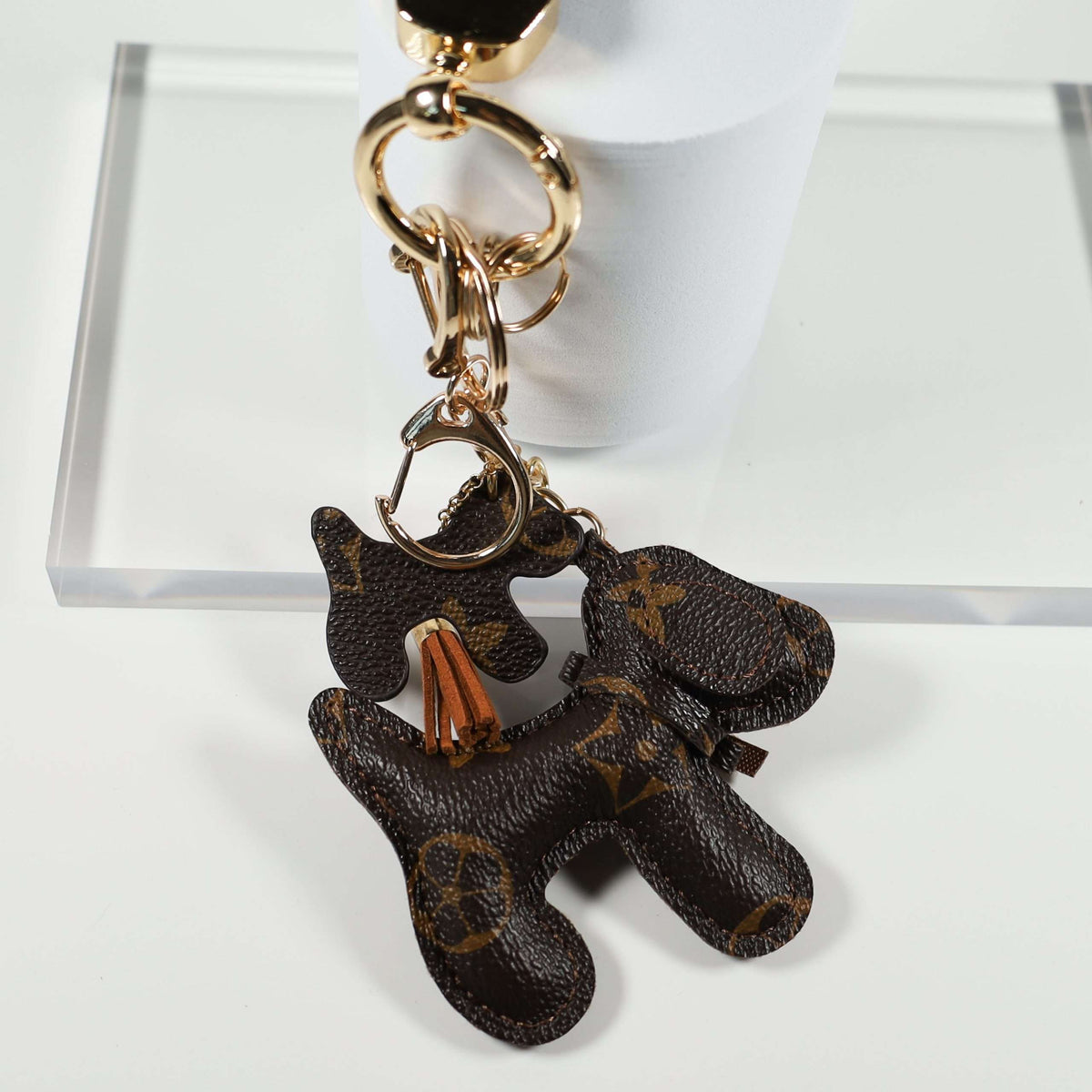 Dog keychain showing matching miniature dog charm and tassel