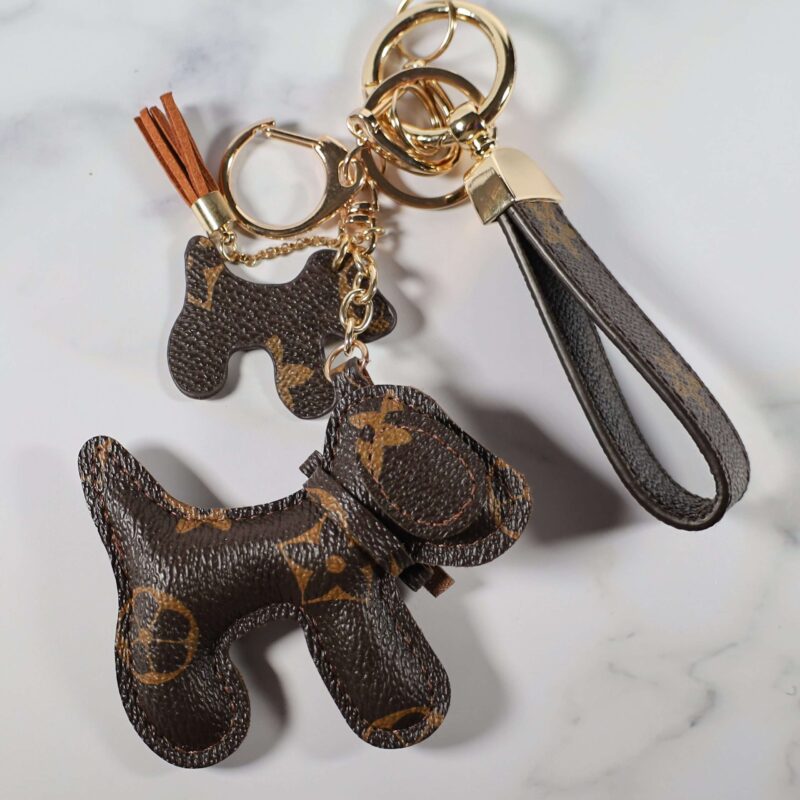 Brown monogram dog keychain with smaller dog charm and wrist strap