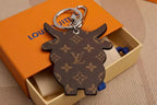 Reverse of flat cow charm with brown monogram pattern