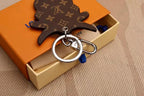 Cow charm backing with silver-tone split ring and swivel clasp