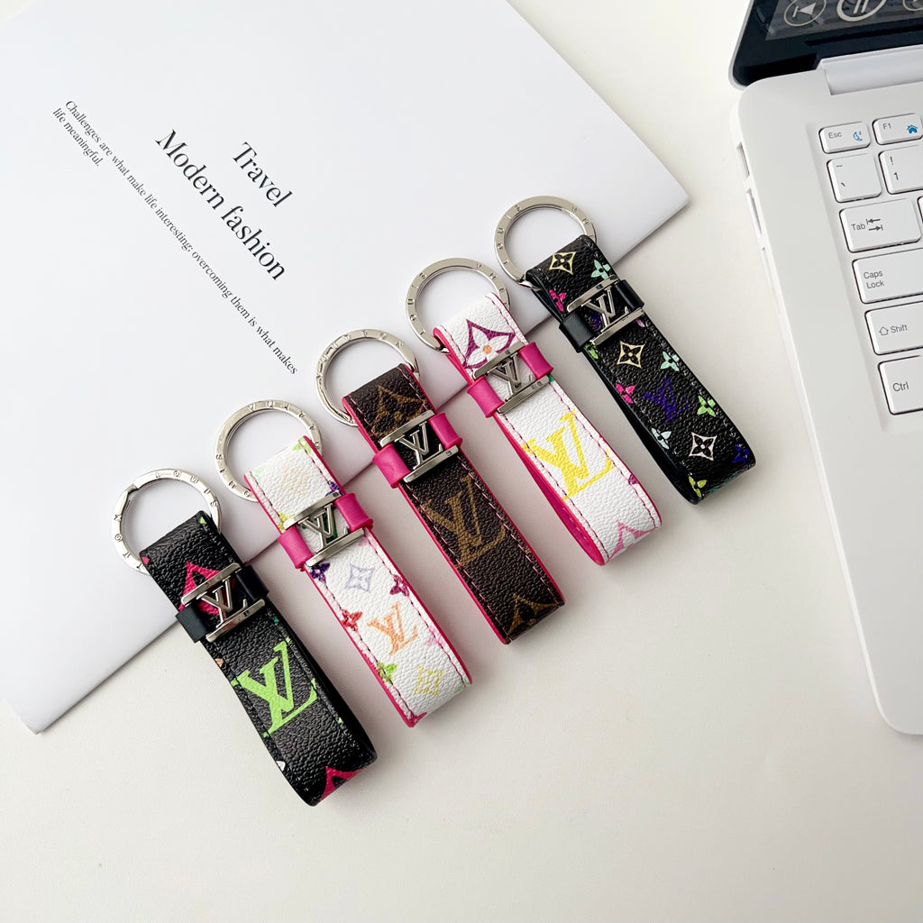Five monogram loop key holders showing colorful patterns