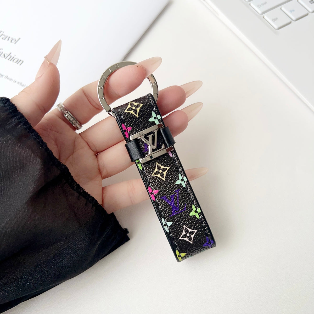 Black loop key holder with small multicolor monogram motifs