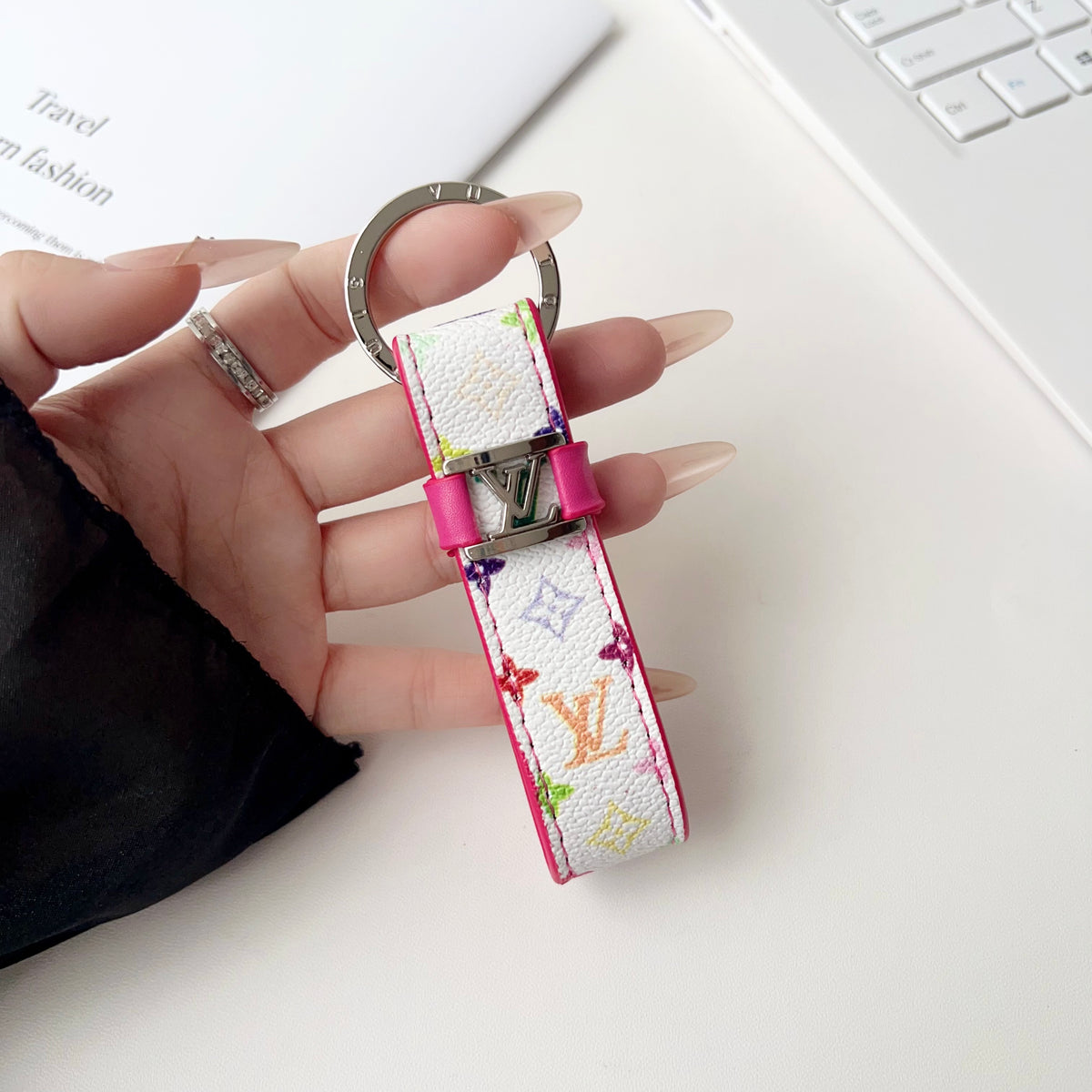 White key holder with small multicolor monogram and pink trim