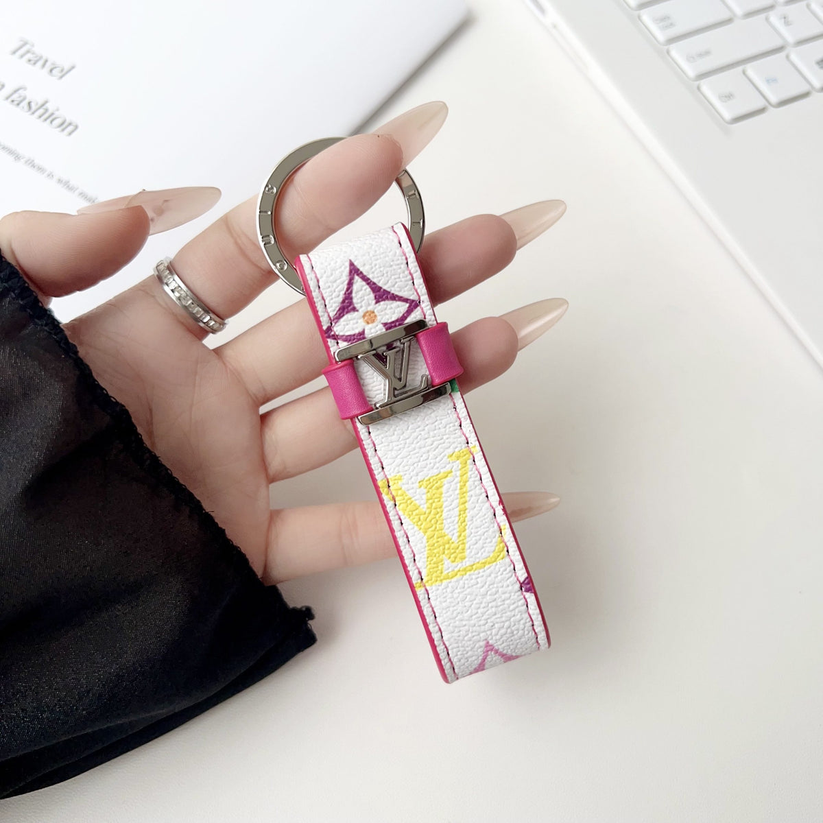 White key holder with oversized colorful letters and pink trim