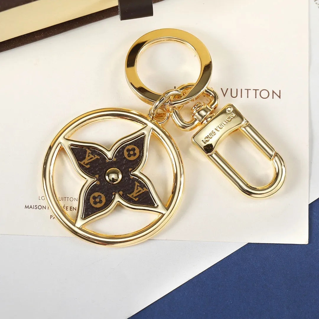 Monogram flower keychain showing round ring and swivel clasp