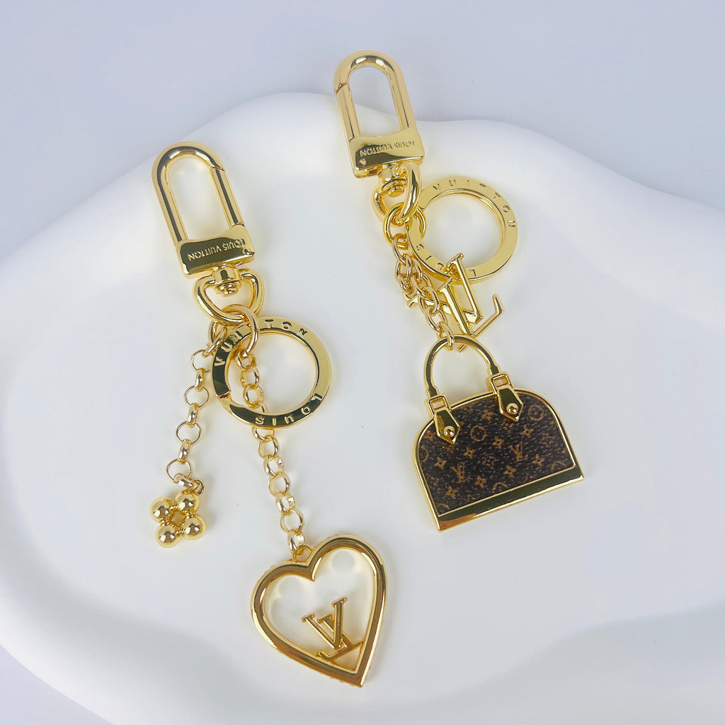 Heart and miniature handbag keychains with gold-tone hardware