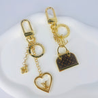 Heart and miniature handbag keychains with gold-tone hardware