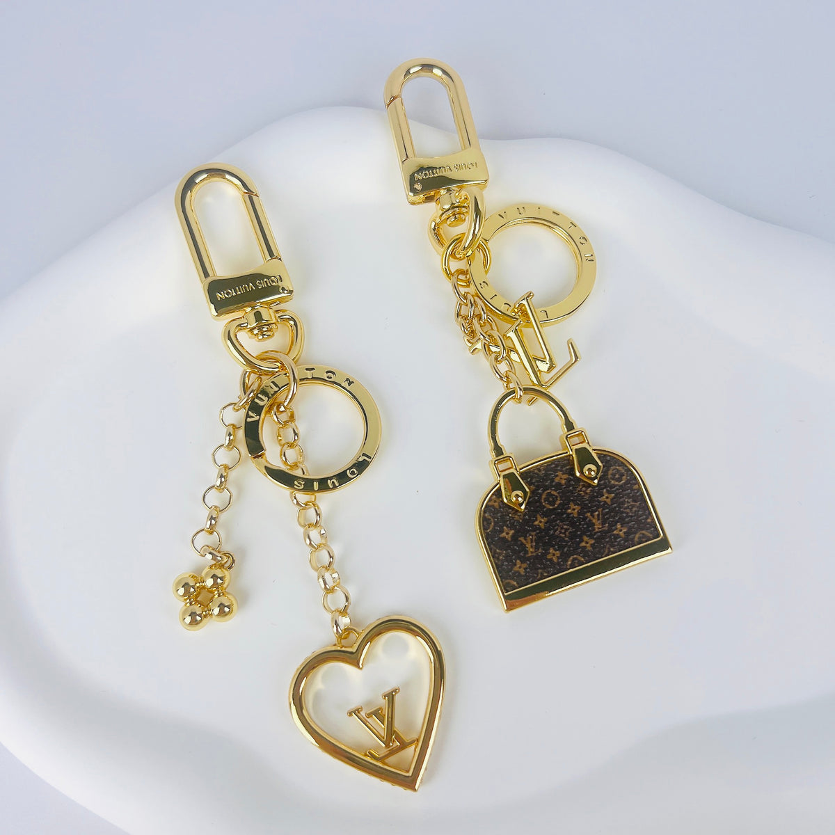Heart and miniature handbag keychains with gold-tone hardware