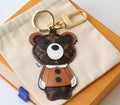 Brown monogram bear keychain with tan jacket and gold-tone hardware