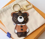 Brown monogram bear keychain with tan jacket and gold-tone hardware
