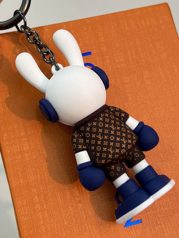 Rear close-up of bunny keychain with patterned brown jacket