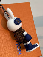Side profile of bunny keychain with blue headphones