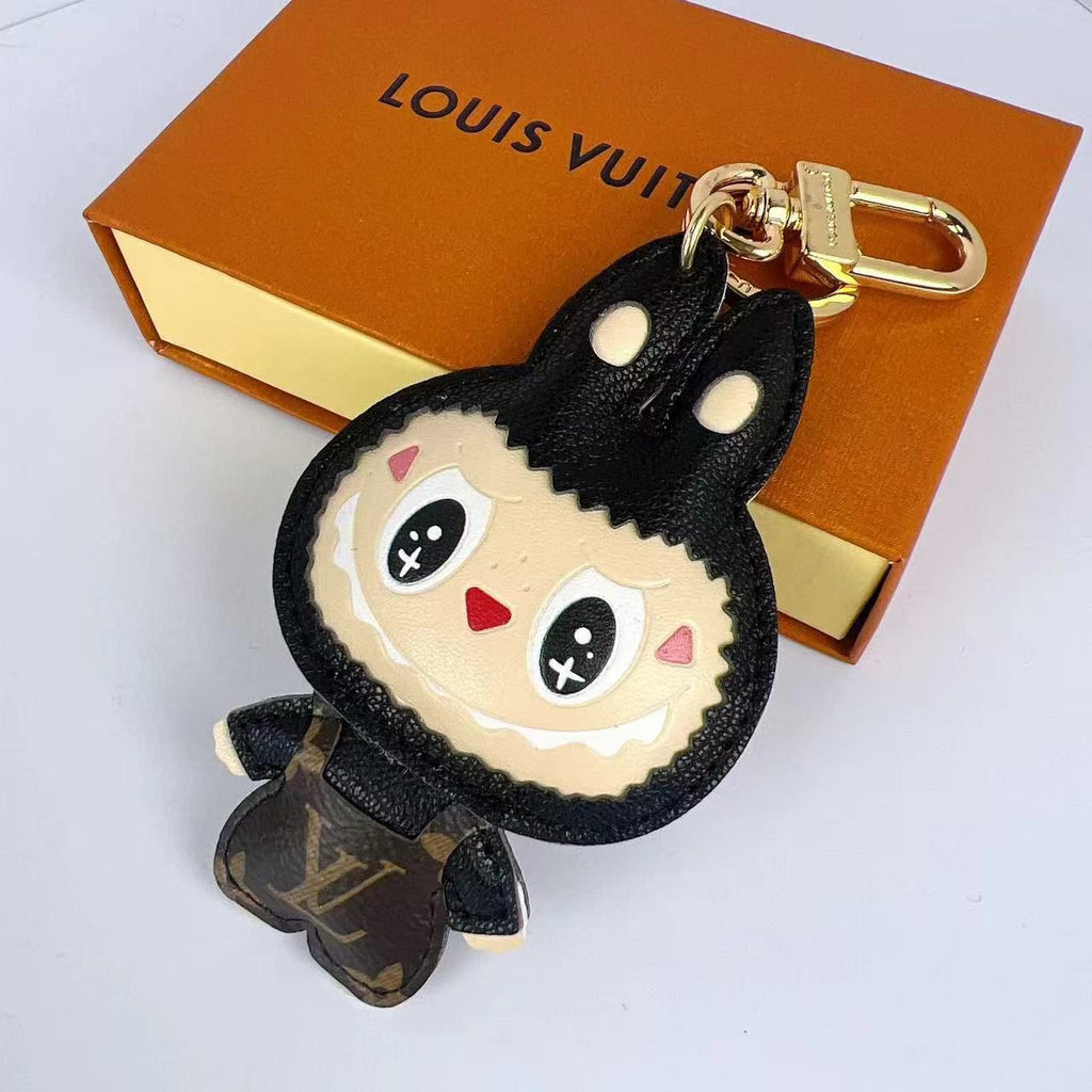 Black Labubu keychain with smiling face and monogram body