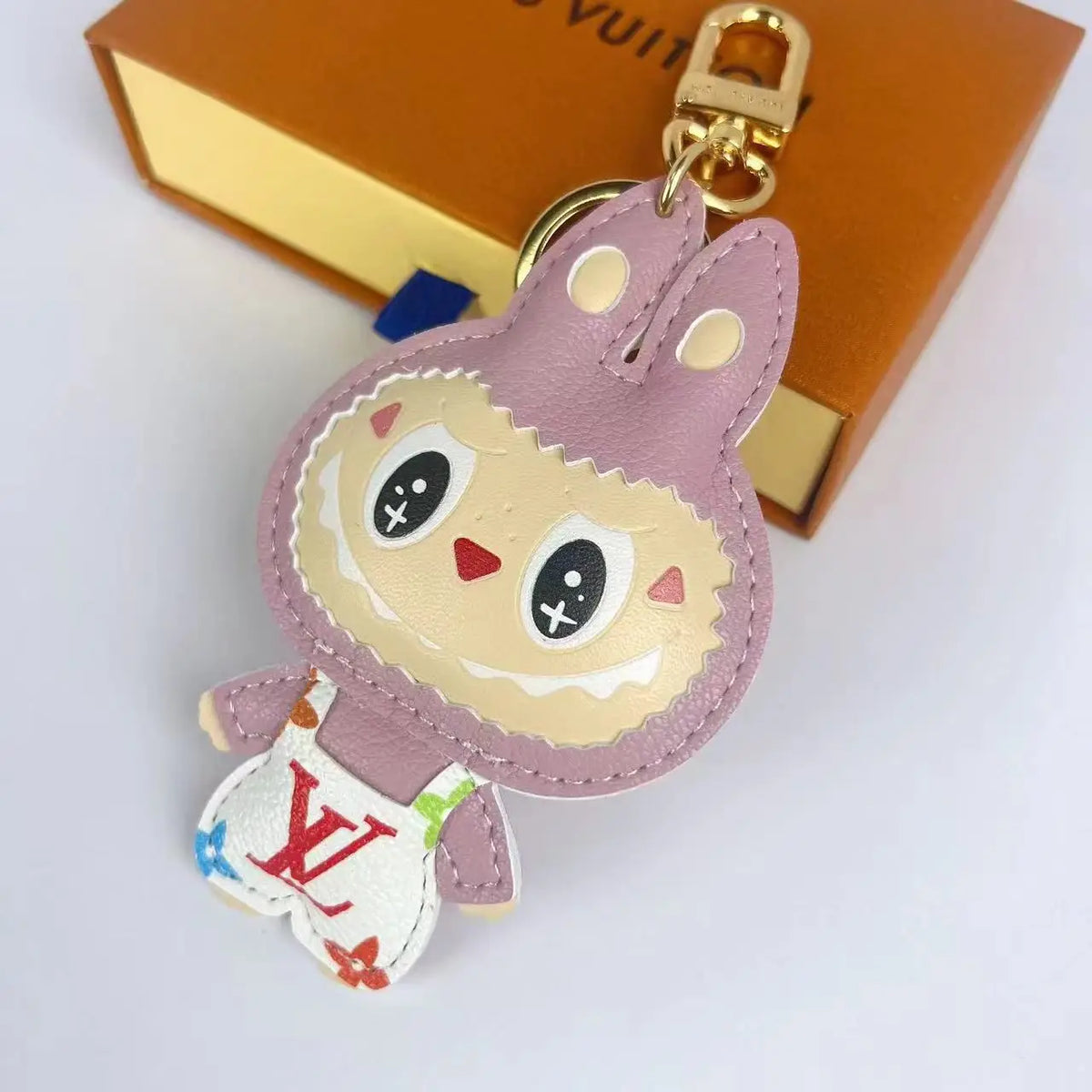 Blush Labubu keychain with white multicolor monogram body