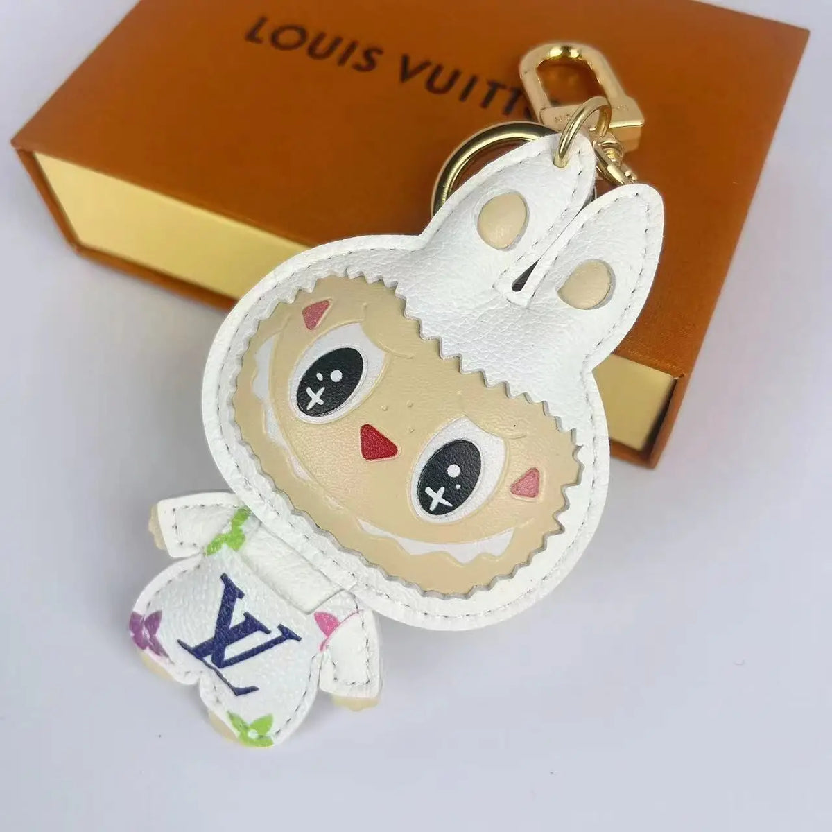 White Labubu keychain with colorful LV lettering