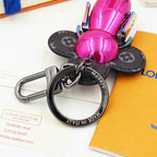 Reverse detail of pink Vivienne charm and engraved keyring