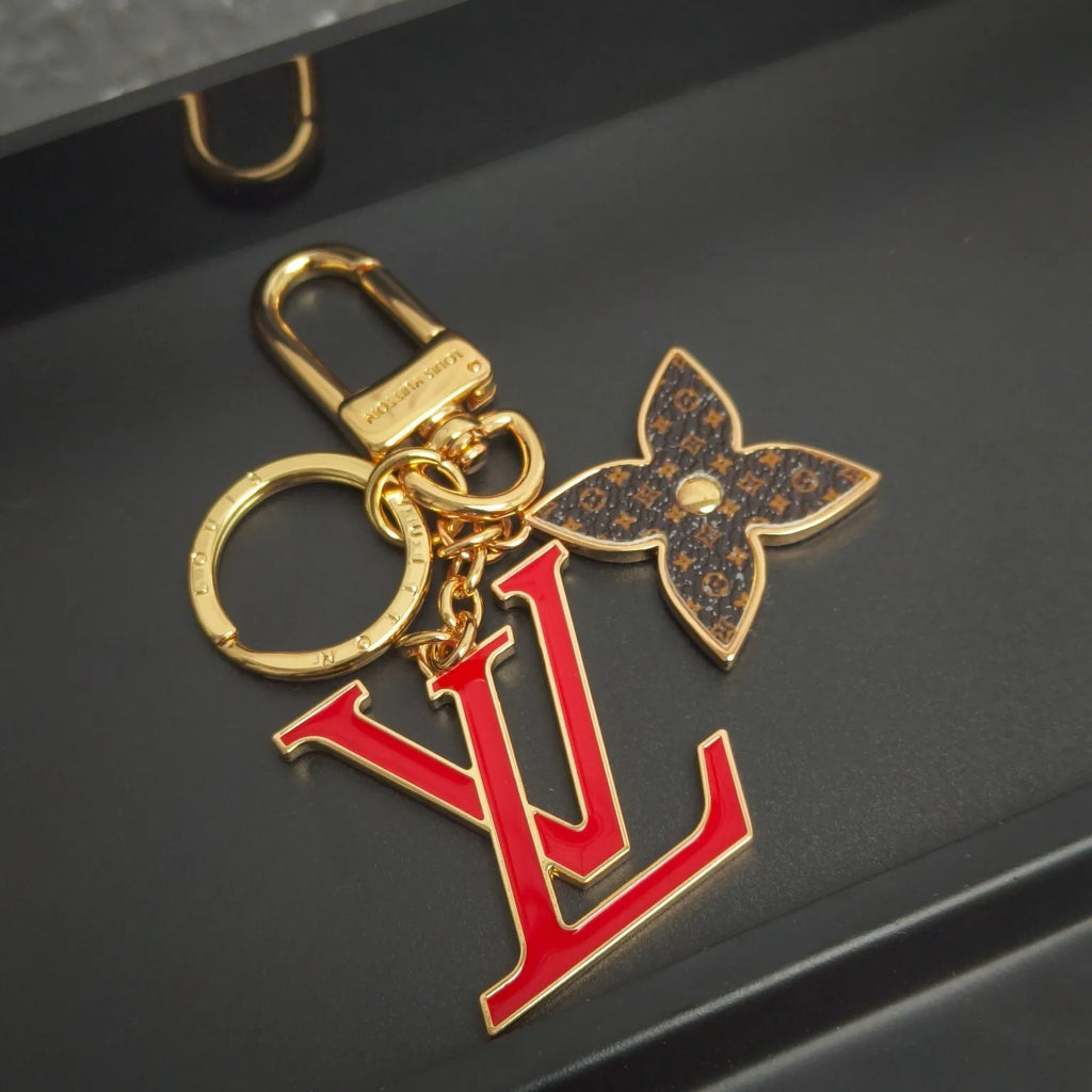 Red LV letter keychain with brown monogram flower charm
