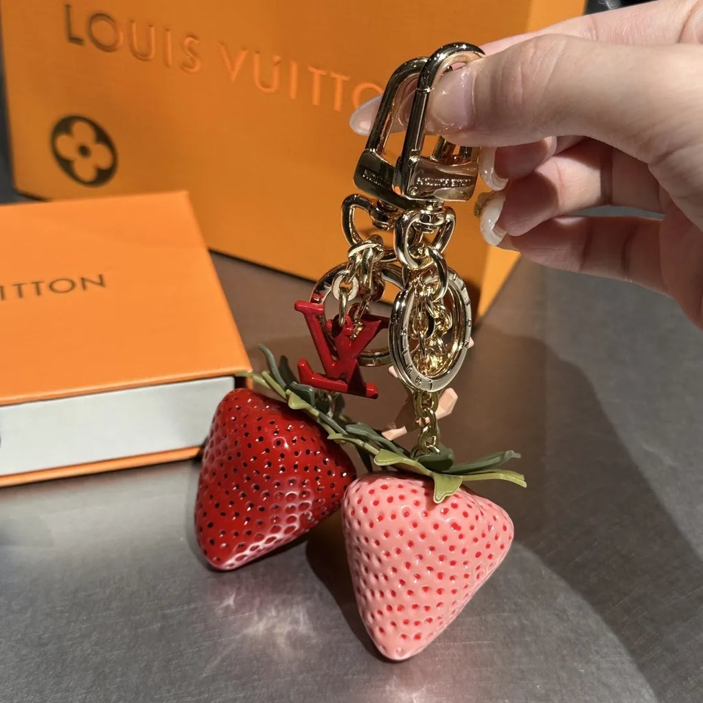 Strawberry keychains held together showing textured red and pink charms