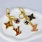 Pink and red LV ornament keychains with gold-tone clasps