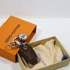 Monogram tag keyring with round LV pendant in packaging