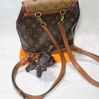 Monogram bulldog keychain displayed beside a matching backpack