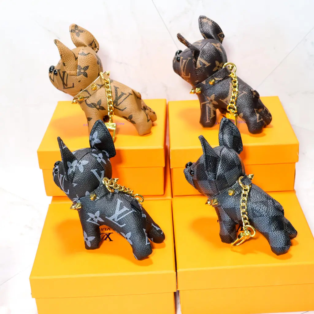 Tan and dark French bulldog keychains with gold-tone chains
