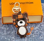 Brown cat keyring with orange accents and white belly