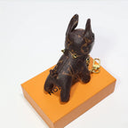 Rear view of brown dog keychain with pointed ears