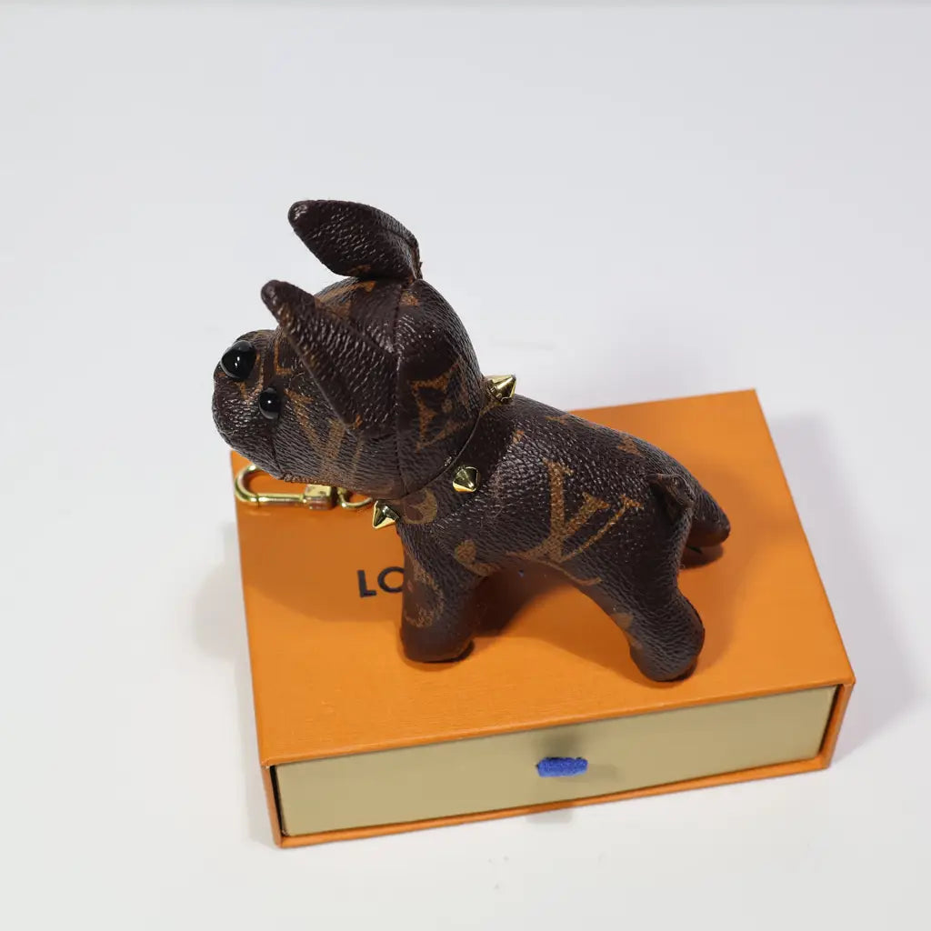 Brown monogram dog keychain shown in side profile