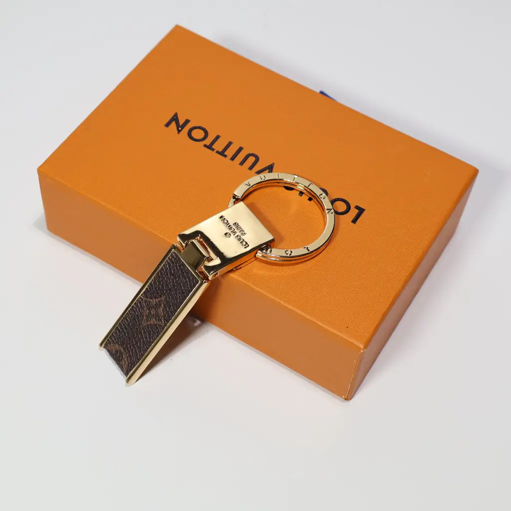 Brown monogram folding keychain with gold-tone hinged hardware