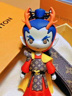 Close-up of Dragon Prince charm with orange horns and red outfit
