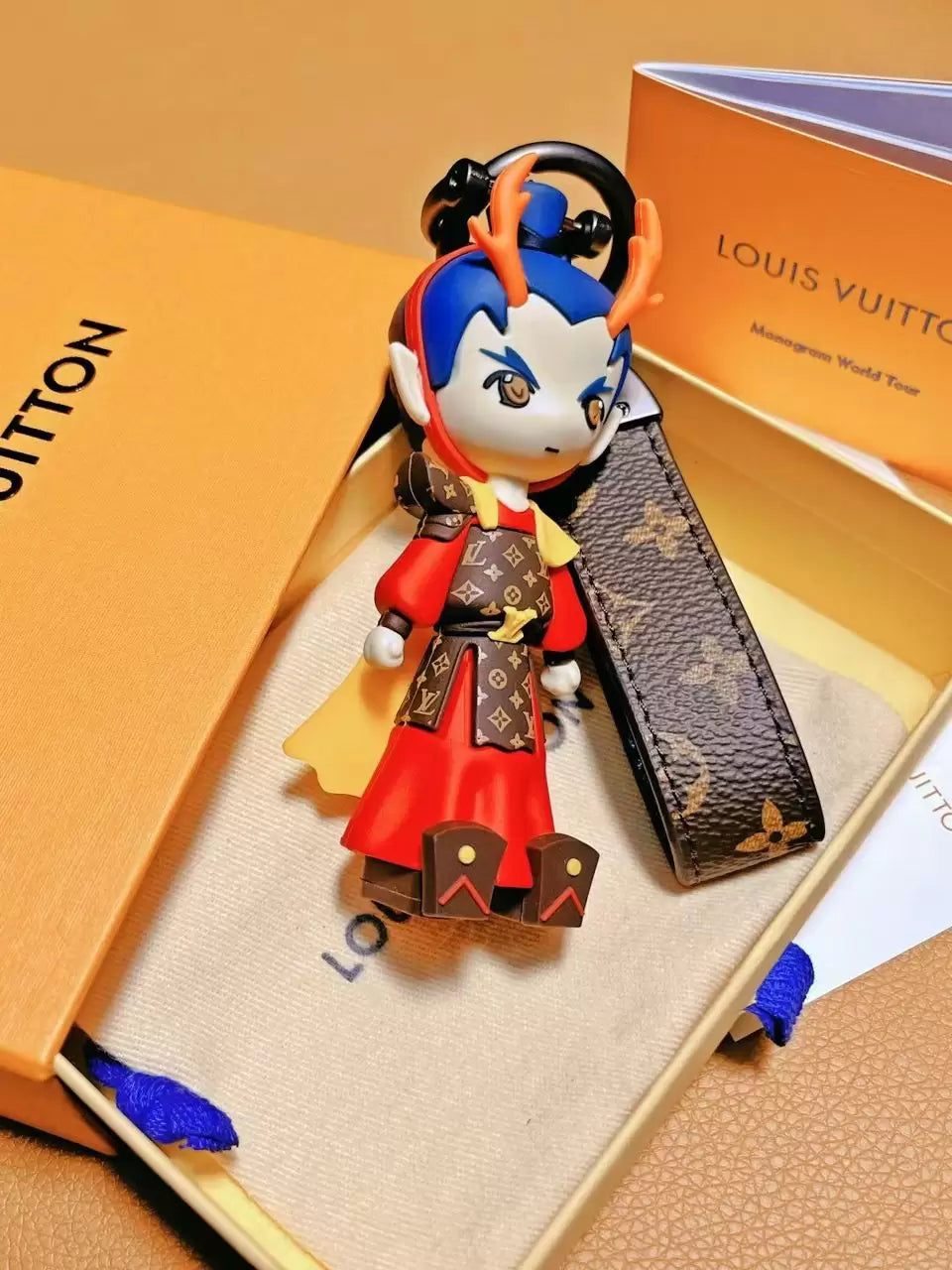 Red Dragon Prince charm standing inside open packaging