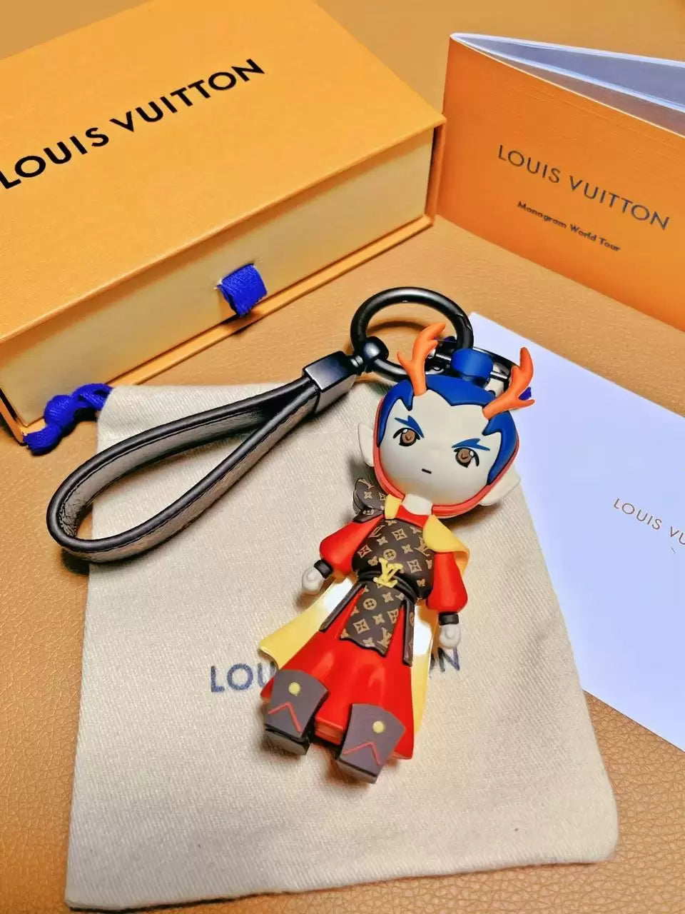 Dragon Prince keychain with blue hair and dark loop strap