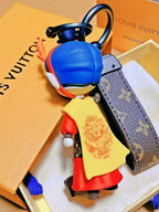 Rear view of Dragon Prince keychain showing yellow cape
