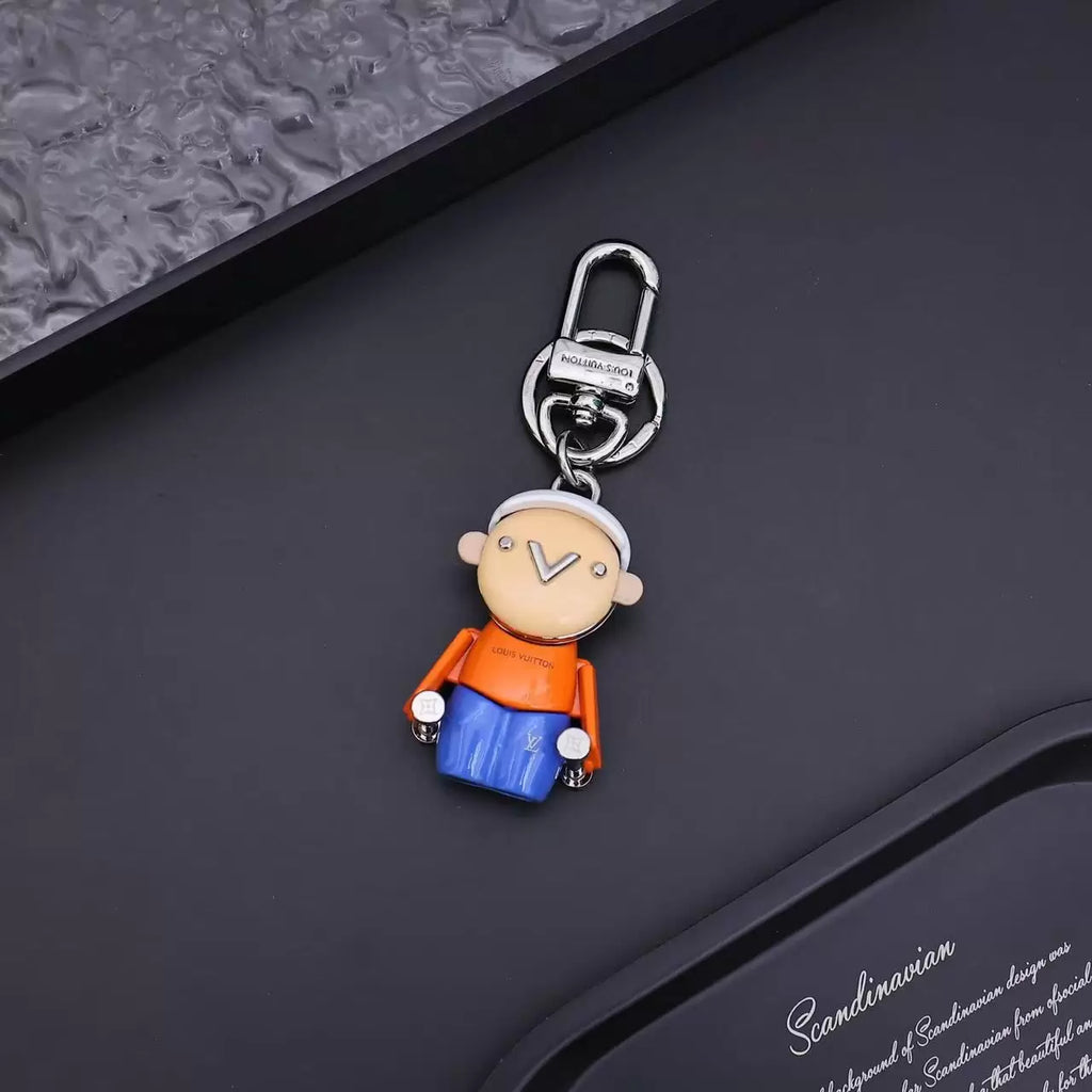 Vivienne Brother keychain with orange shirt and blue body