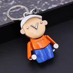 Close-up of character keychain with white cap and V-shaped nose