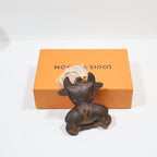 Rear view of monogram cow keychain showing stitched center seam