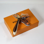 Top view of brown sneaker keychain showing dark strap lining
