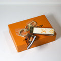 Brown sneaker keychain with cream monogram loop strap