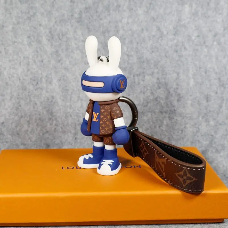 Side view of bunny boxer keychain and brown loop strap