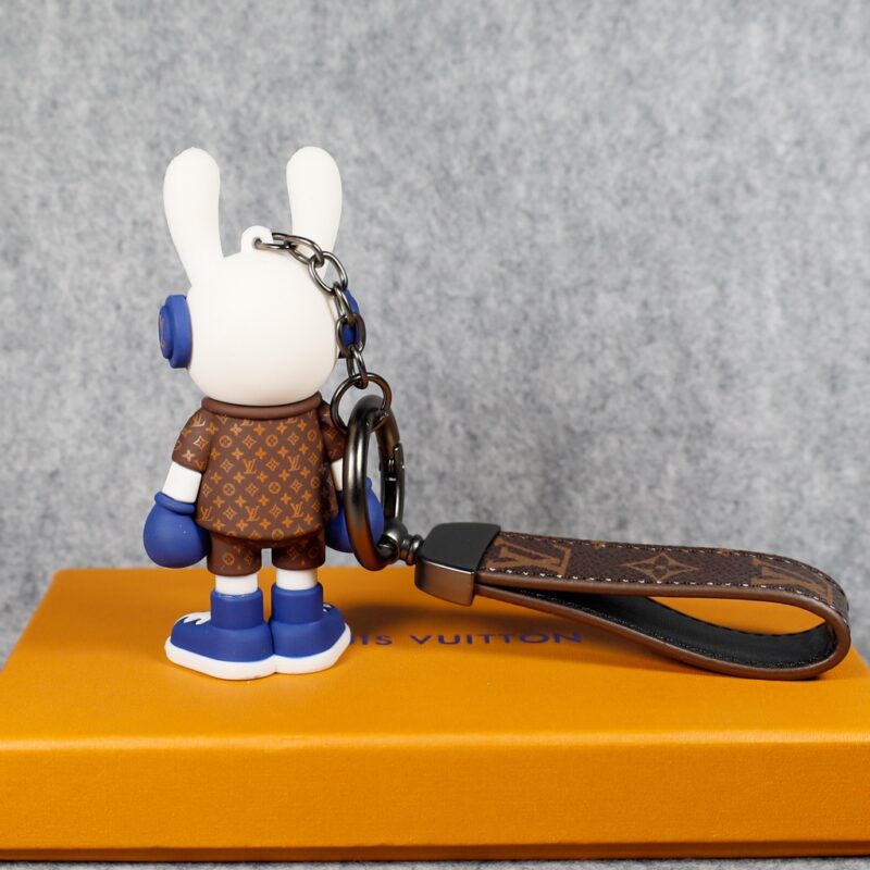 Rear view of blue bunny keychain with monogram jacket
