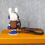 Rear view of blue bunny keychain with monogram jacket