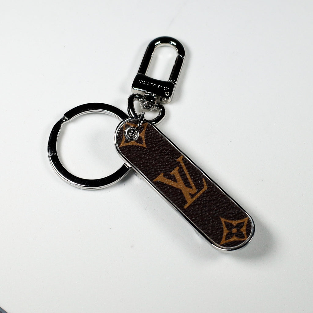 Brown monogram skateboard charm with dark swivel clasp