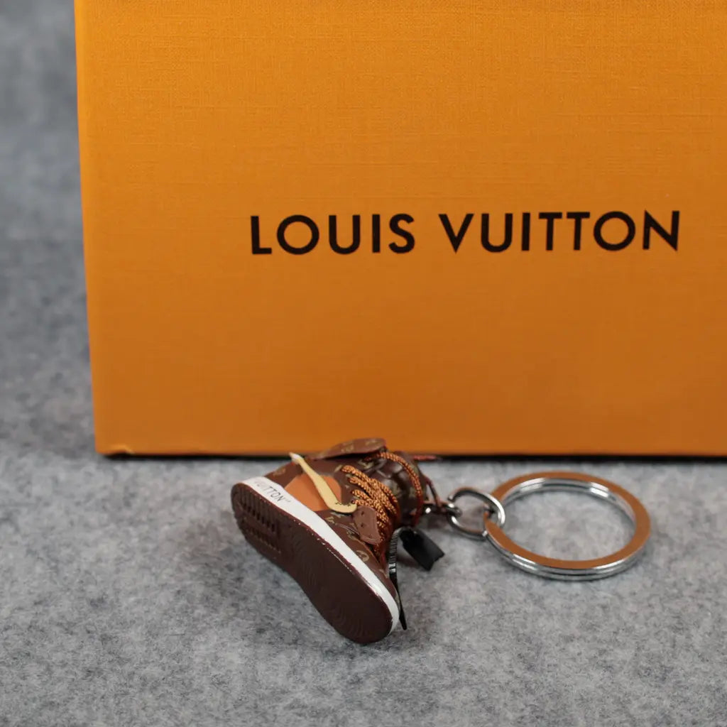 Angled sole view of brown sneaker keychain